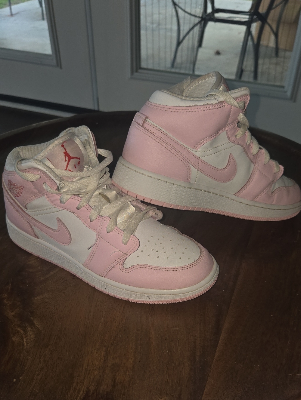 Nike Jordan 1 Kids Pink and White Mid-Top Sneakers with Swoosh